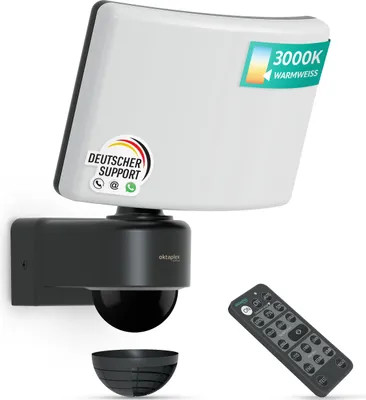 A product shot of a motion-activated outdoor light with a remote control.