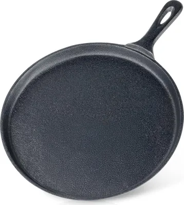 A black cast iron frying pan shown from the underside and side.