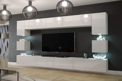 A modern living room with a wall-mounted entertainment unit and TV.