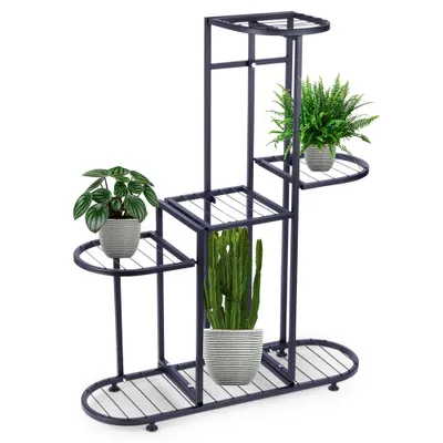 A multi-tiered metal plant stand holding several potted plants against a white background.