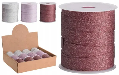 A collection of glitter ribbon rolls in various colors, displayed in a cardboard box and as individual rolls.