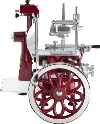 A red and silver meat slicer shown from the side.
