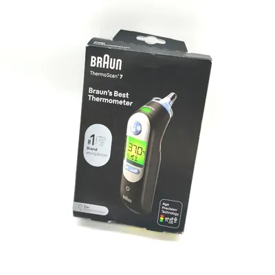 The image shows the retail packaging of a Braun ThermoScan 7 ear thermometer against a white background.