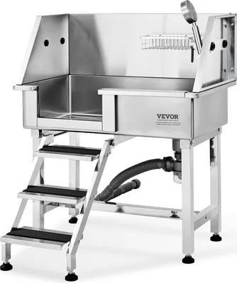 A professional stainless steel dog grooming tub with stairs and a shower head.