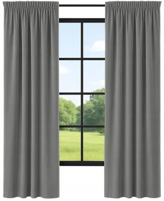 Two gray curtains are drawn back to reveal a window with a view of trees and a blue sky.