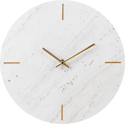 A close-up of a round wall clock with a marble-like pattern and gold hands.