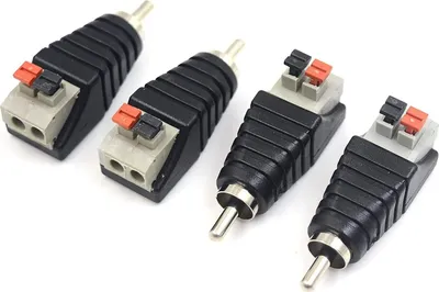 Four RCA to speaker wire adapters are arranged diagonally on a white background.