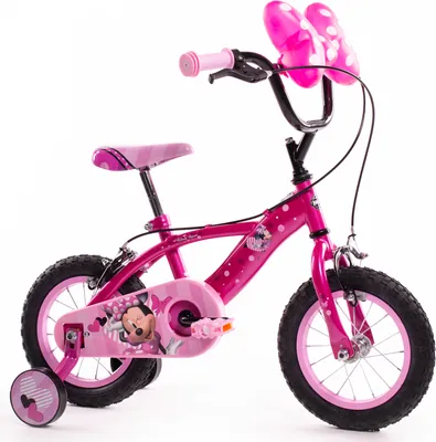 A pink children's bicycle with Minnie Mouse decorations, shown against a white background.