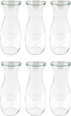 Six clear glass bottles arranged in two rows of three.