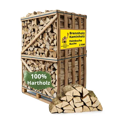 A large wooden crate filled with firewood, with a pile of firewood in front of it, against a white background.