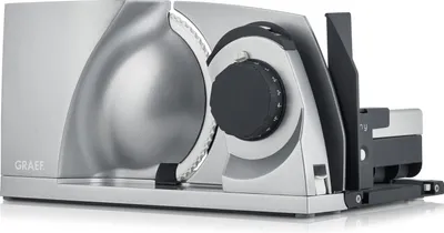 A silver electric slicer is shown from a side angle on a white background.