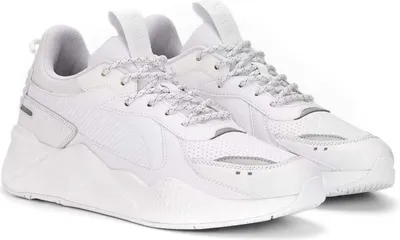 A pair of white Puma sneakers is shown against a white background.