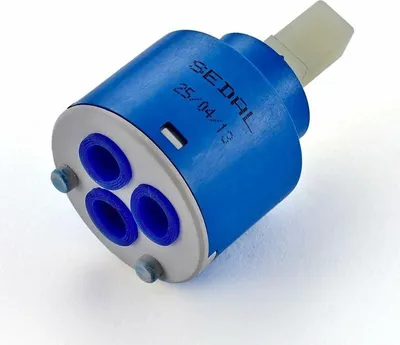 A close-up studio shot of a ceramic cartridge for a faucet.