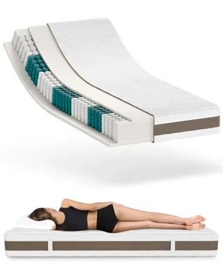 A cutaway view of a mattress and a person sleeping on a mattress.