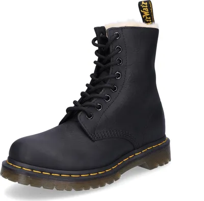 A black Dr. Martens boot with white fur lining is shown against a white background.