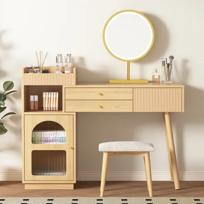 A vanity table set with a mirror, drawers, and a side cabinet, along with a stool, displayed in a room setting.