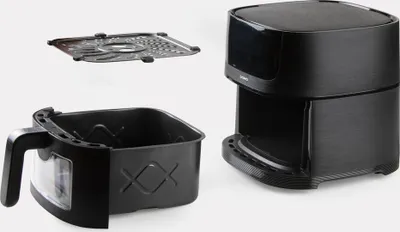 A black air fryer and its accessories are displayed against a white background.