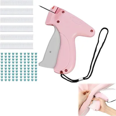 A pink tagging gun with a strap and a set of fasteners, with a close-up inset showing it in use.