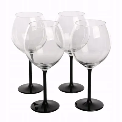 Four clear wine glasses with black stems and bases are arranged on a white background.