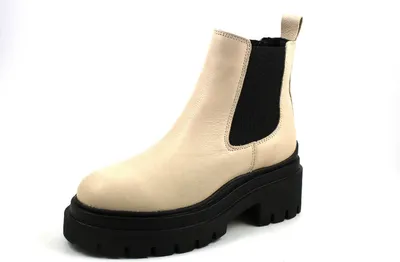 A single beige Chelsea boot with a black platform sole is shown against a white background.