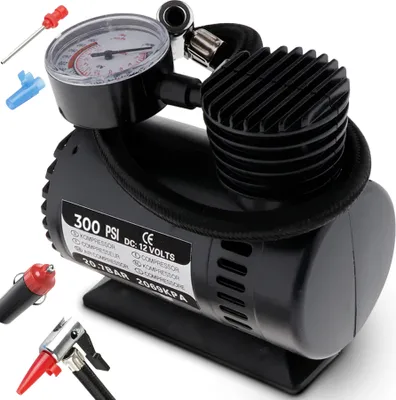 A black portable air compressor with a pressure gauge and various attachments.