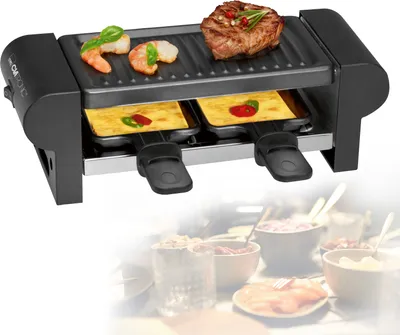A raclette grill with food items on it, set against a blurred background of food bowls and serving dishes.
