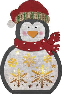 A decorative wooden penguin with a hat and scarf, illuminated by internal lights and featuring snowflake cutouts.