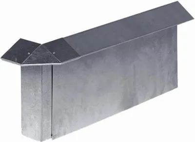 A galvanized metal snail barrier for a garden bed.