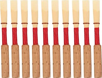 A row of oboe reeds arranged in a line.