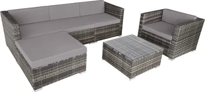 A set of outdoor furniture including a sectional sofa, an armchair, a coffee table, and an ottoman, arranged on a white background.