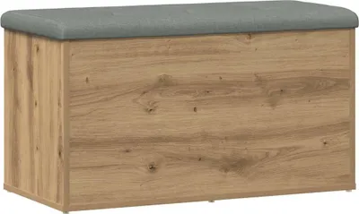 A storage bench with a wood-grain finish and a gray upholstered top, shown from the front.