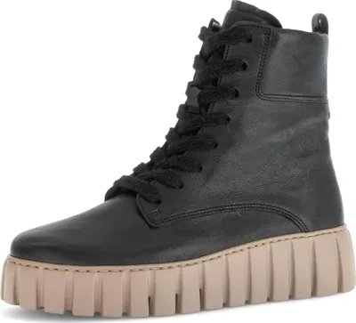 A black lace-up boot with a thick beige sole is shown against a white background.
