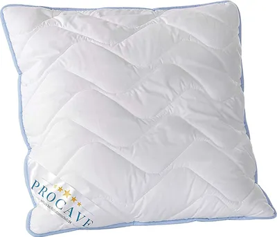 A white quilted pillow with a blue trim and a label on the front.