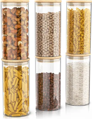 Six glass storage jars with bamboo lids, each filled with different food items, arranged in two rows of three.