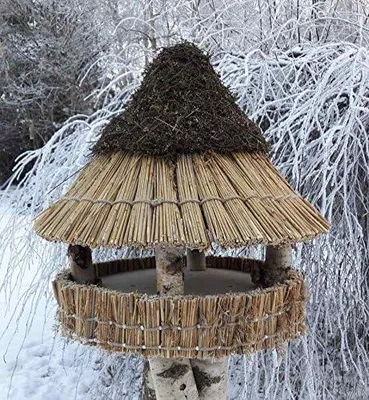 Produktbild von Vogelfutterhaus mit Reetdach und Heidekappe, Heidehütte klein