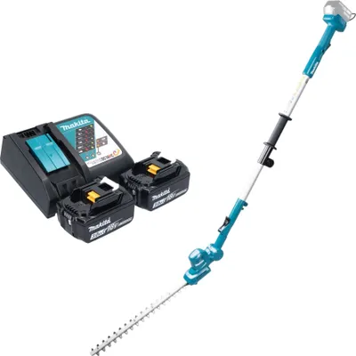 A cordless hedge trimmer set with batteries and charger.