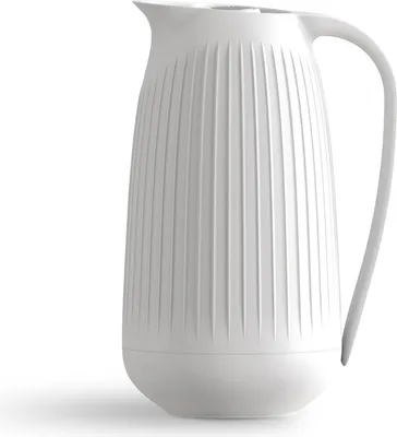 A white pitcher with vertical ridges on a white background.