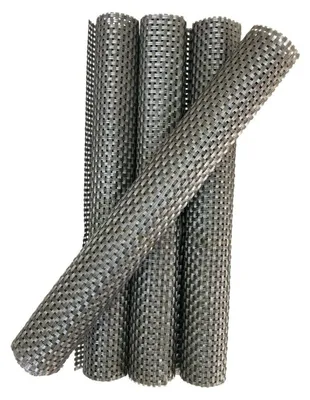 Several rolled-up placemats are stacked and leaning against each other on a white background.