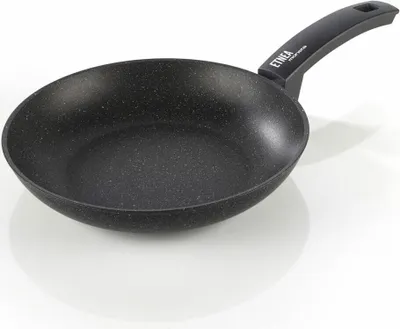 A black frying pan with a speckled interior and a black handle is shown against a white background.