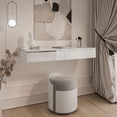 A modern vanity table with a stool in a well-lit room.