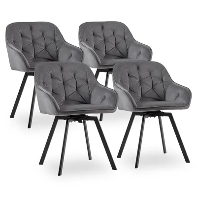 Four gray velvet dining chairs with black legs are arranged on a white background.
