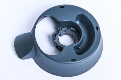 A gray plastic base part for a kitchen appliance, shown on a white background.