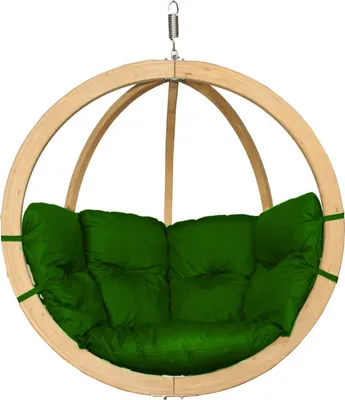 A hanging chair with a green cushion, suspended by a spring.
