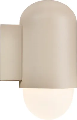 A close-up of a sand-colored outdoor wall light with a rounded top and a frosted glass bulb at the bottom.