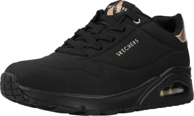 A single black Skechers sneaker with rose gold accents.