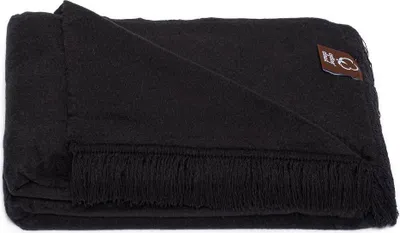 A folded black blanket with fringe on one side.
