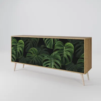 A sideboard with a tropical leaf pattern on a plain background.