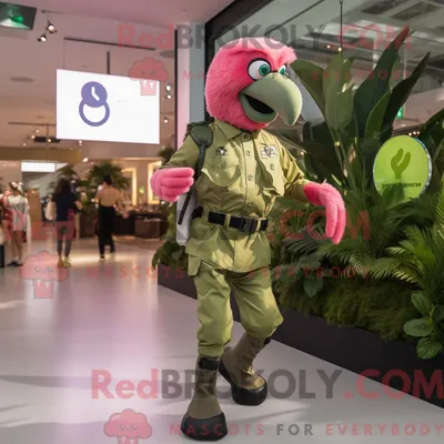 Produktbild von Maskottchen-Charakter REDBROKOLY eines olivgrünen Flamingos bekleidet mit Überwurf und Smartwatches