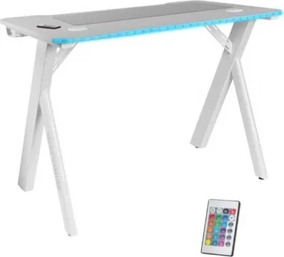 A white gaming desk with blue LED lighting and a remote control.