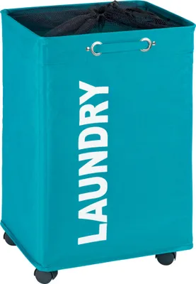 A teal laundry basket with the word "LAUNDRY" printed vertically in white on the front. It has a drawstring mesh top and four small wheels at the base.